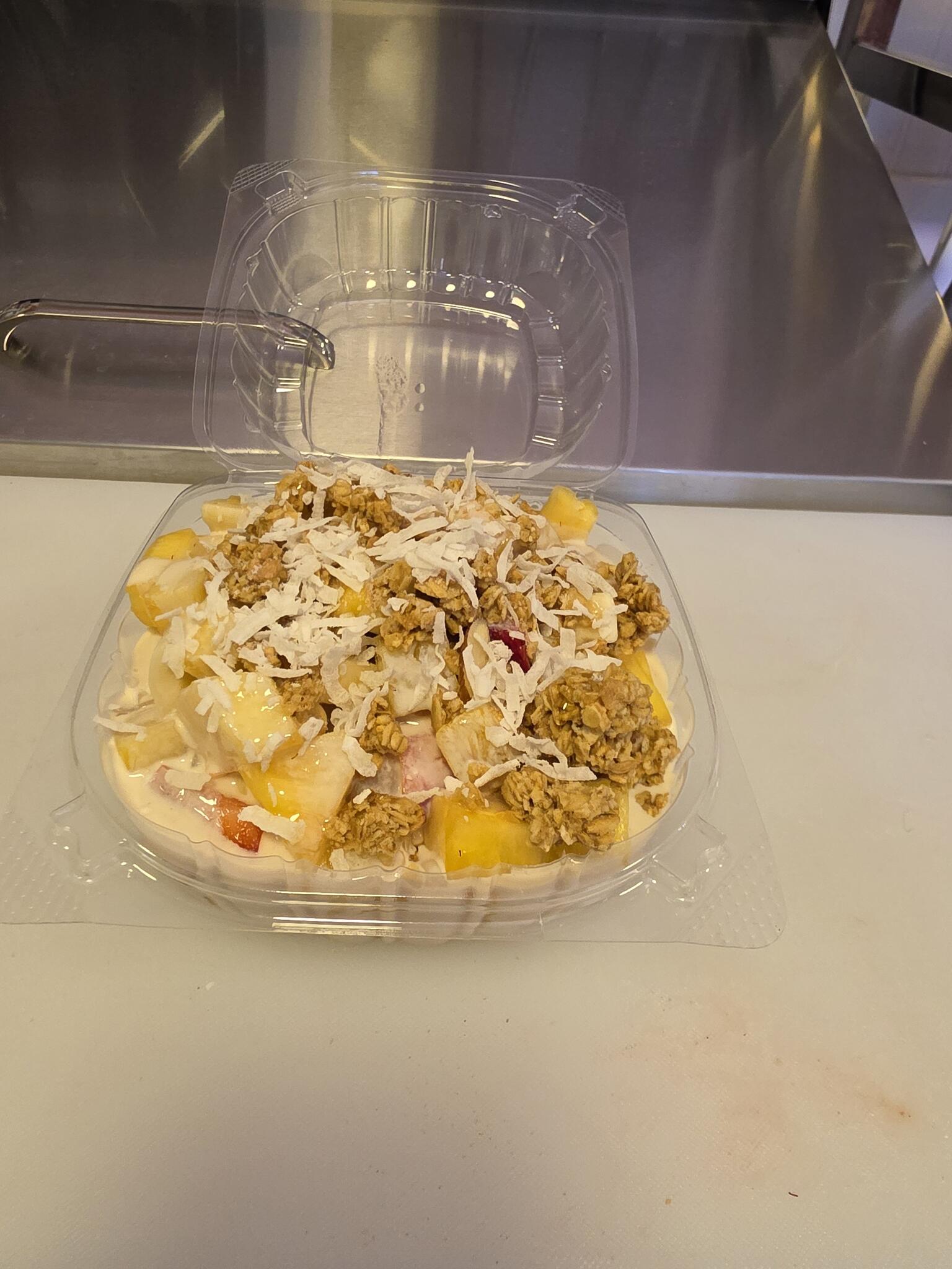 Bionico with fresh fruit, cream, granola, and coconut